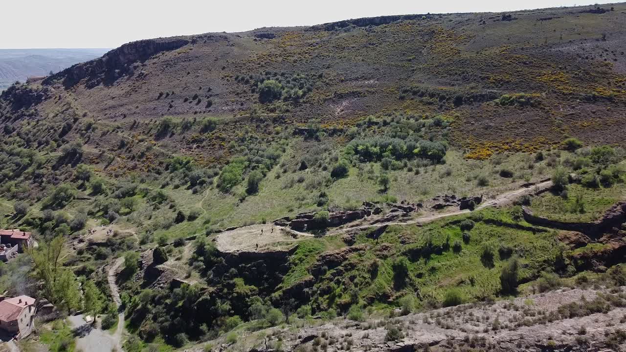 Beautiful town and ruins filmed with mini drone flying around a medieval village in Spain close to Madrid