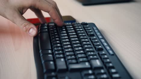 person typing on a keyboard