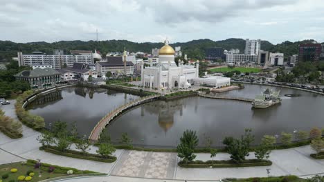 Aerial-drone-shot-of-beautiful-garden-complex-in-front-of-the-Sultan-Omar-Ali-Saifuddien-Mosque-in-Bandar-Seri-Bagawan-in-Brunei-Darussalam