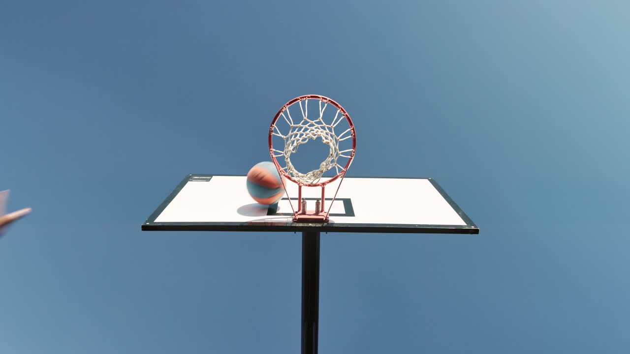 Basketball shot with blue sky backdrop