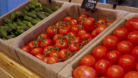 fresh tomatoes and cucumbers at grocery store