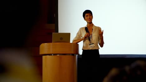 young asian businesswoman speaking in business seminar in auditorium 4k