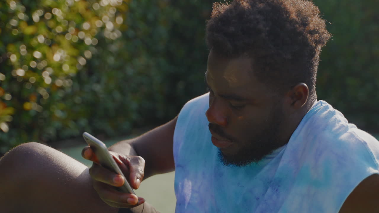 Man using a smartphone outdoors