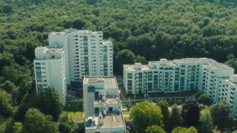 orbit drone shot close to emmertsgrund neighborhood and white buildings during the day in heidelberg, state of baden-wurttemberg, germany