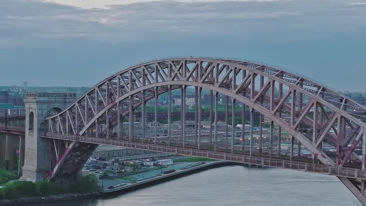 View of a bridge in New York City over the water during twilight hours