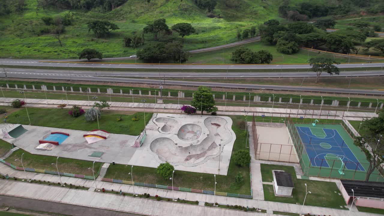 Aerial view of La Victoria park, green hills, sports, calm atmosphere
