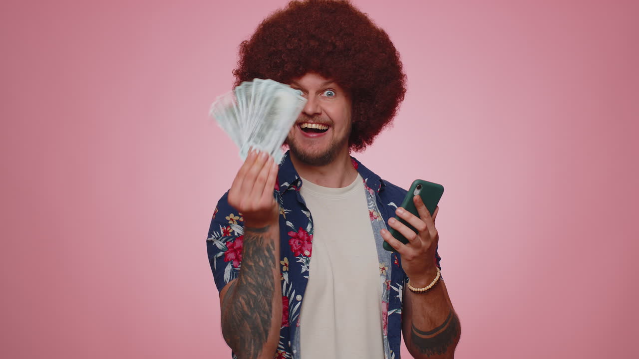 Happy tourist man use smartphone rejoicing win, receiving money dollar cash, success lottery luck
