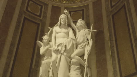 eglise de la madeleine, interior church, sculpted group of baptism of jesus, paris, france. low angle pov