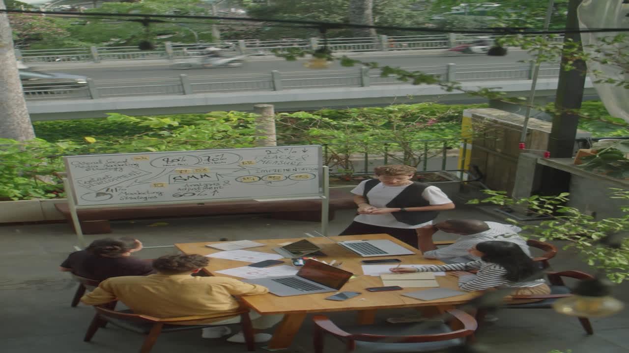 Team of Business People Having Meeting on Rooftop Terrace