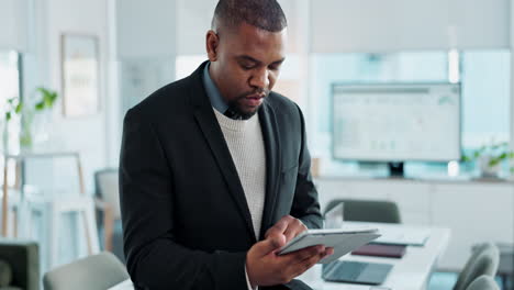 man working on a tablet in an office
