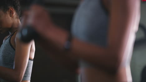 4k footage of a young woman working out at the gym