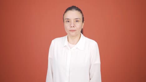 woman looking at camera with dull expression.