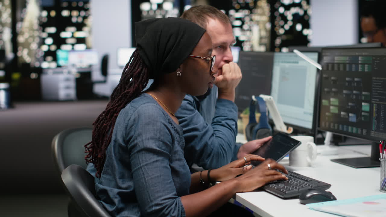Diverse Developers Collaborating on Software Project in Modern Office