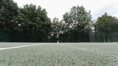 female amateur tennis player playing in park