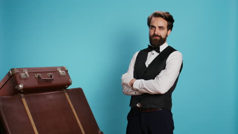 hotel porter with baggage in studio