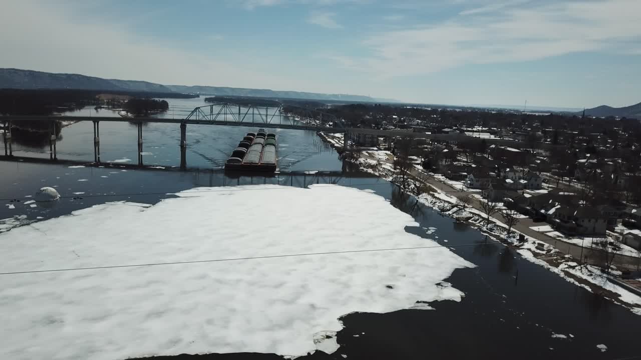 Barges Navigating Icy River