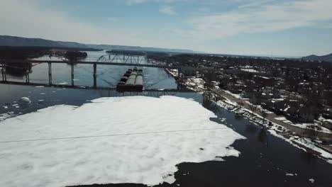 barges navigating icy river