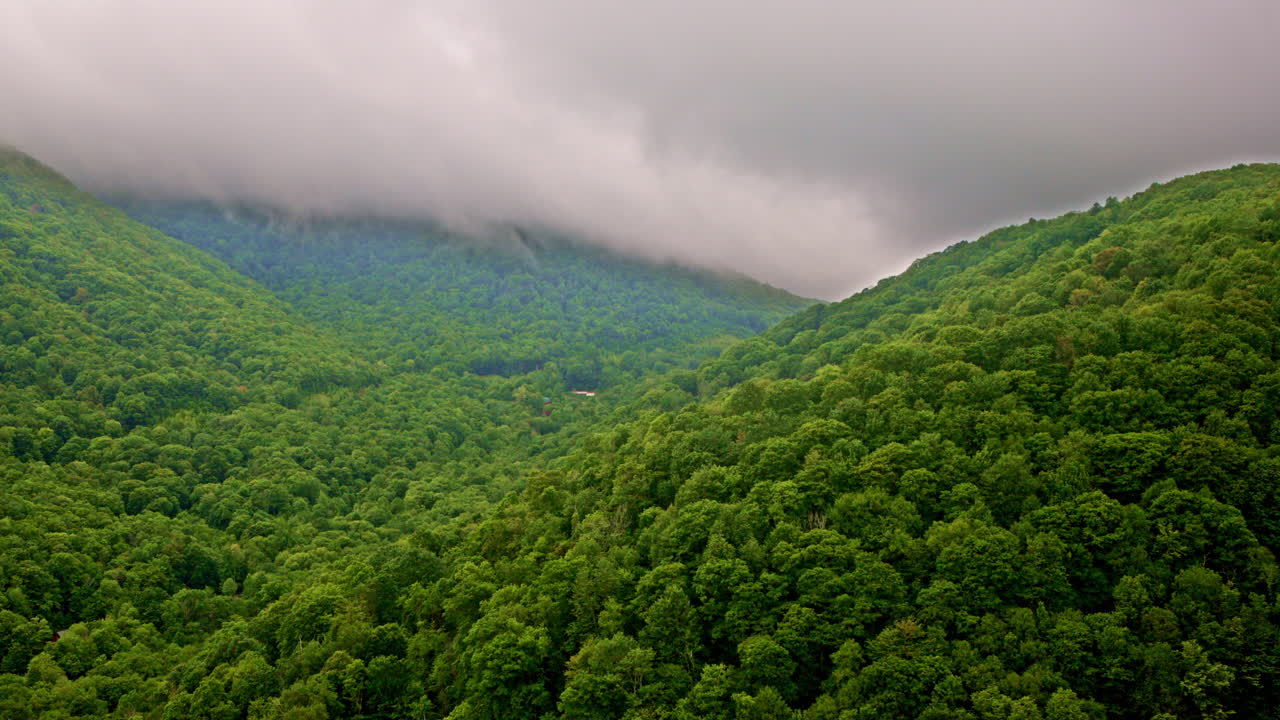 Cloud-kissed Smoky Mountains from a cinematic aerial perspective