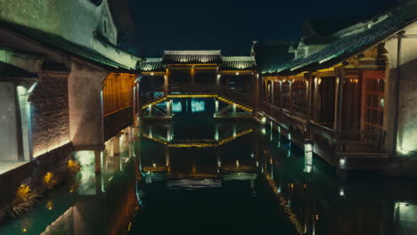 night scene of a chinese waterway town with reflections