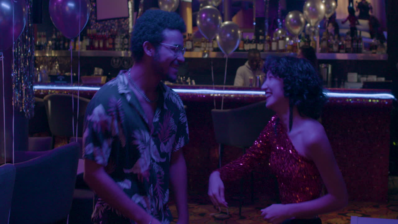 Friends dancing in a party