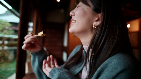 woman eating dessert in a japanese restaurant