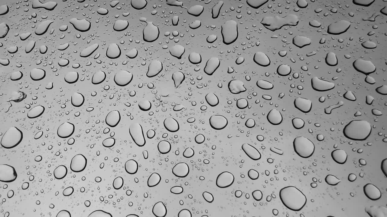 Water Droplets on a Gray Surface