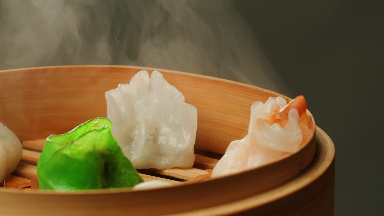 Freshly Steamed Dim Sum Dumplings in a Traditional Bamboo Steamer