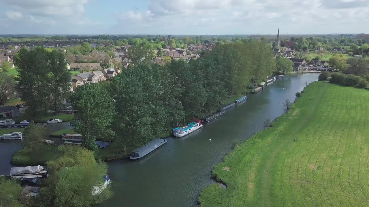 River Thames In Abingdon Town Near Oxford City, UK With A Beautiful Green Landscape During Summer. - aerial shot