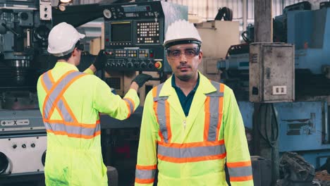 young factory worker or engineer close up portrait in factory