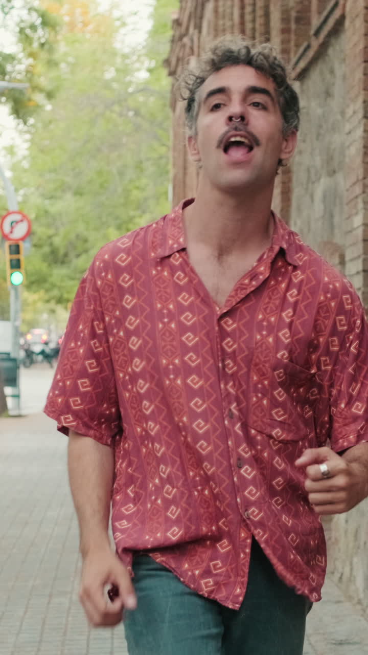 Happy Man with Mustache Dancing on City Sidewalk