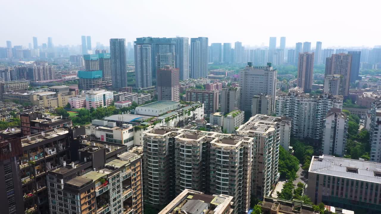 Pull out drone shot of Manhattan nature giant dollhouse apartment building during the day in Chengdu, province of Sichuan, China
