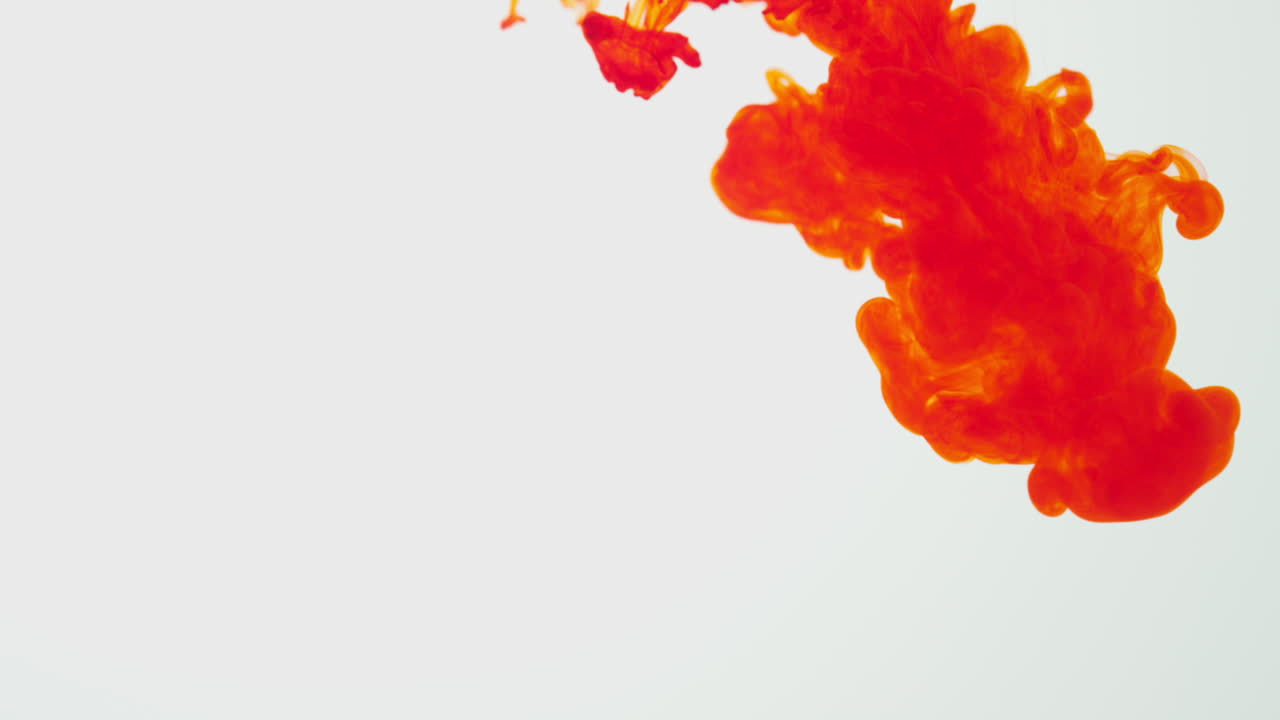 Orange Paint Or Dye Dropped Into Water Against White Background To Create Swirling Colourful Smoke Background 4