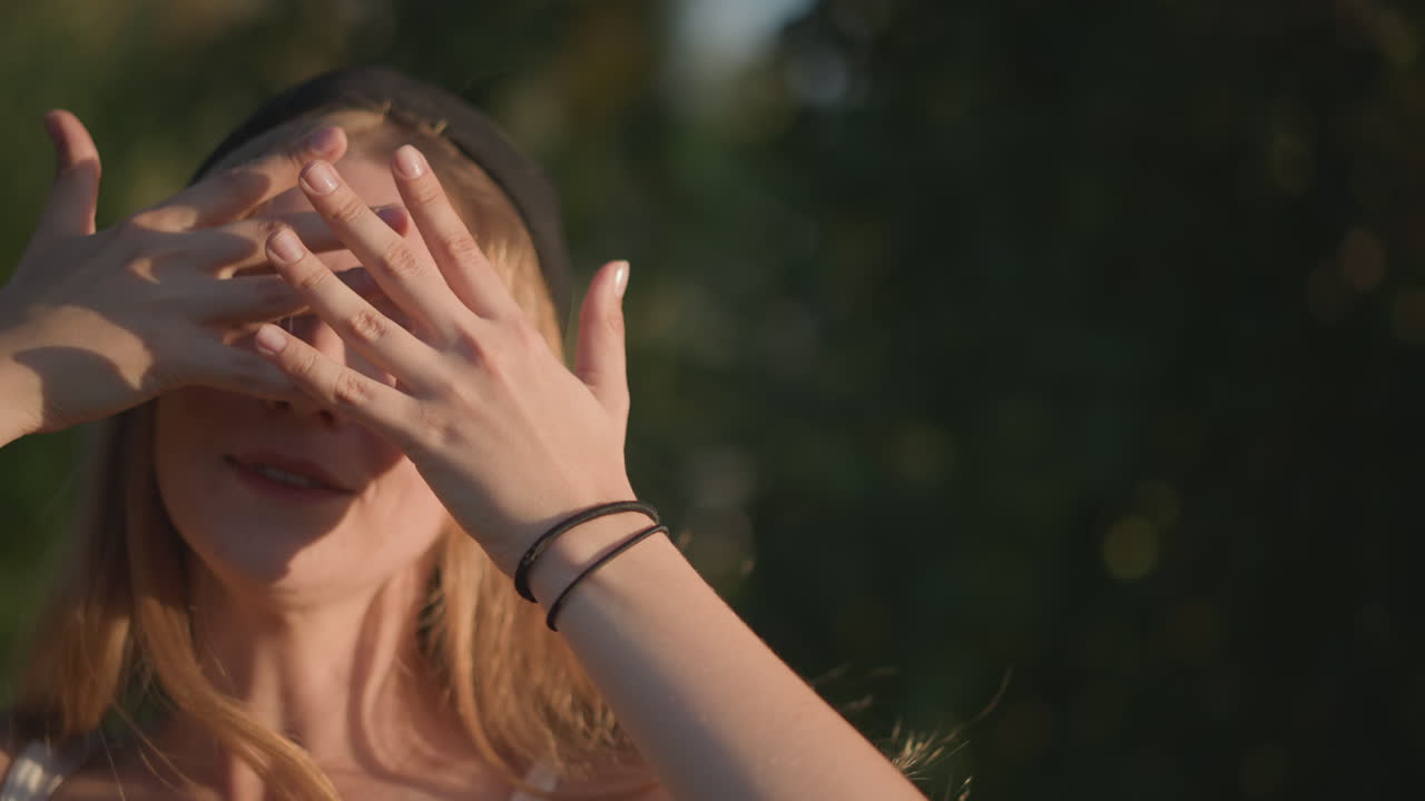 Elegant woman performs outdoor dance, Graceful woman in nature executes expressive dance movements, Delicate woman dances beautifully outdoors with gentle hand gestures around trees