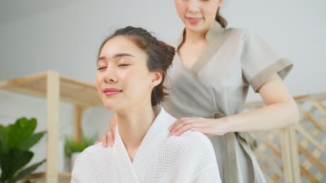 woman receiving a shoulder massage at a spa