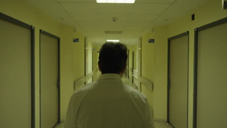 doctor walking down hospital corridor