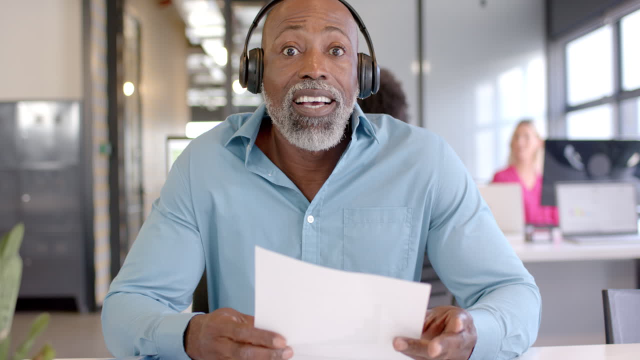 Business African American man reviews documents in an office