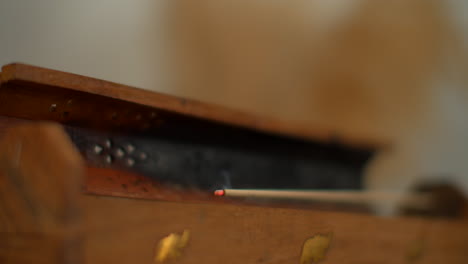 incense burning in wooden box