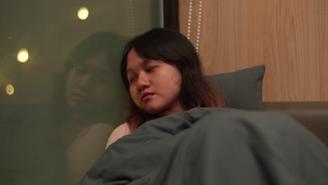 young girl dozing, comfortable safe home, window reflections, close-up