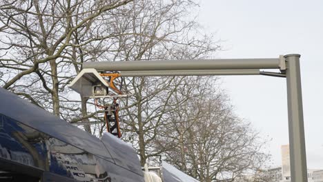 pantograph for electric bus charging at the bus stop - static medium shot