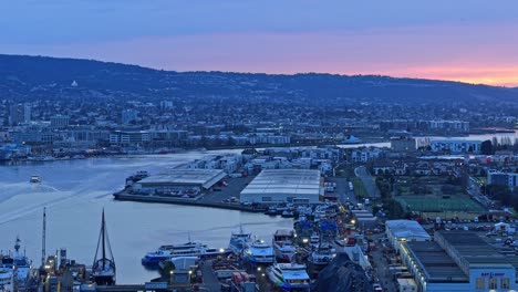 aerial panning shot of alameda point during the morning twilight hours.
