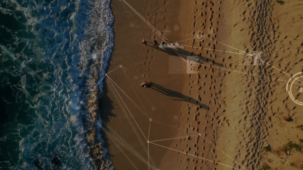 Couple walking shore tide urging stepping into surf to feel waves, tech overlay linking prints