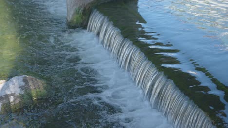 small city waterfall. the river flows