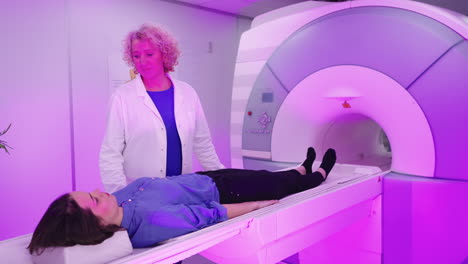 patient undergoing mri scan with medical professional
