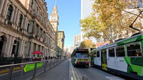 tram moving along a busy melbourne street