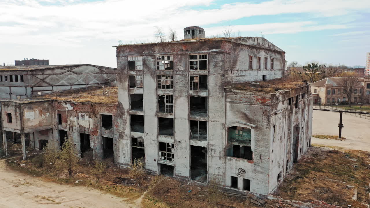Flight over the destroyed factory. Old industrial building for demolition. Aerial view