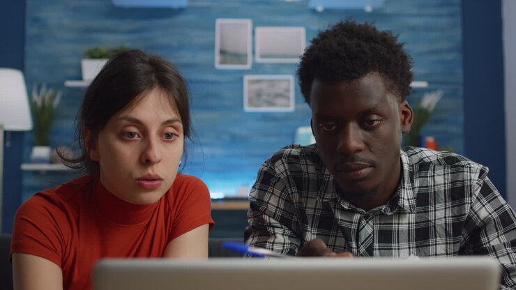 Interracial couple planning money for taxes payment