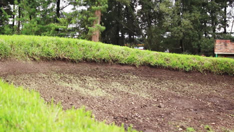 motorcyclists taking a curve in a motocross competition