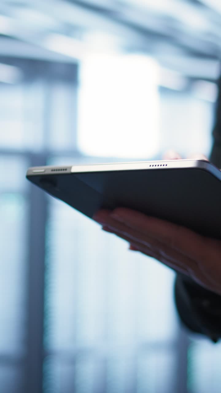 Close-up of Person's Hands Using a Digital Tablet