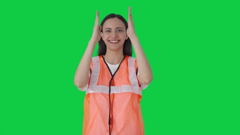 Indian-airport-ground-staff-giving-directions-to-airplane-on-duty-Green-screen