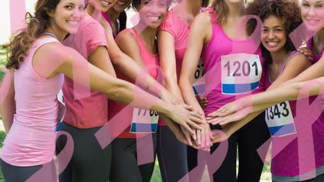 animation of multiple pink ribbon logo over diverse group of smiling women